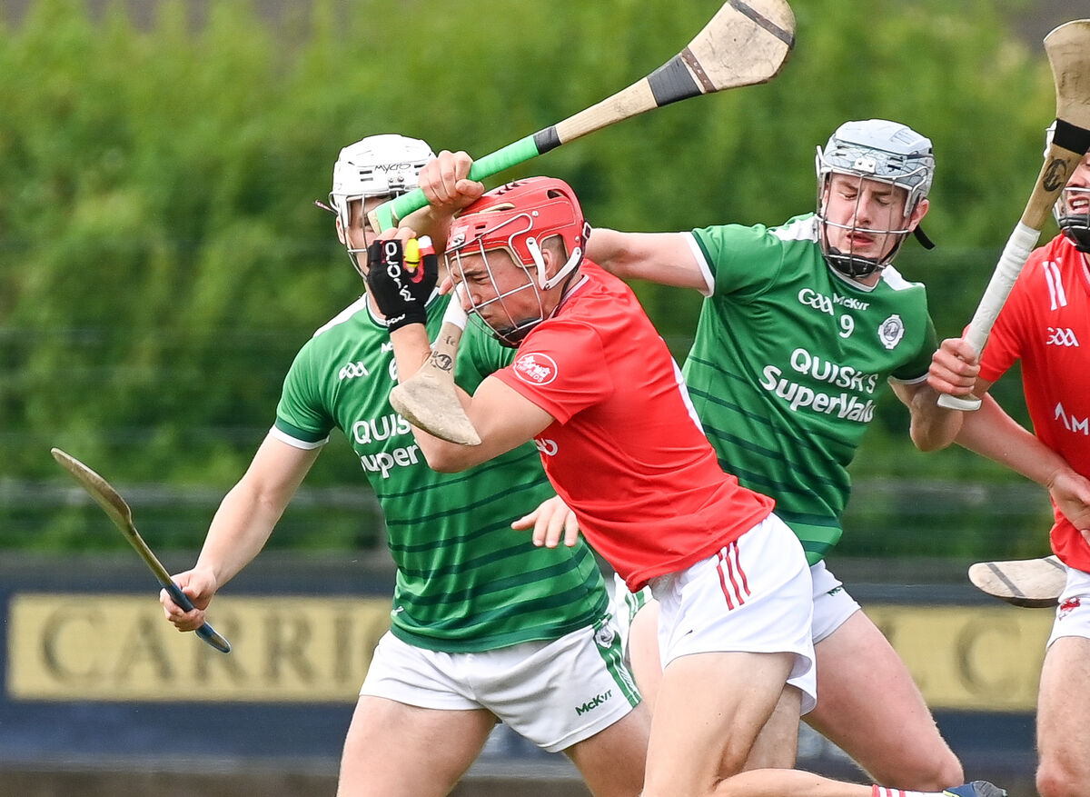 Castlemartyr's Ciaran Joyce is tackled by Ballincollig's Theo Morgan and David O'Sullivan. Picture: David Keane. Castlemartyr's Ciaran Joyce is tackled by Ballincollig's Theo Morgan and David O'Sullivan. Picture: David Keane.