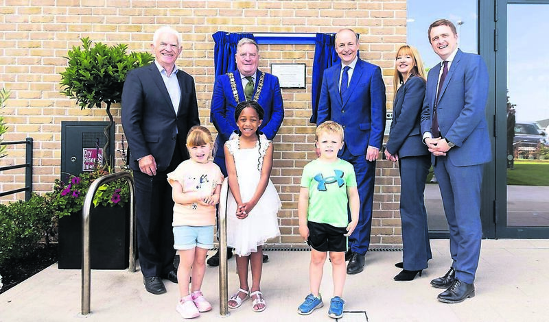 John O’Connor, Chairman Respond; former lord mayor of Cork, Cllr. Dan Boyle; An Taoiseach Micheál Martin.; Aoife Watters, CEO at Respond; housing minister James Browne, with with children Luna Pereira, Tiana Hemedy and Harvey Connolly, at Jacob's Island, Mahon Point, Cork, marking a significant milestone in one of Cork's largest social and cost rental housing developments, led by Approved Housing Body and service provider Respond. The project will deliver 218 high-quality homes in total. During his visit, the Taoiseach officially opened 69 new social homes already completed and turned the sod on the next phase of 149 Cost Rental homes, due for completion in 2027.Picture: Alison Miles /OSM PHOTO John O’Connor, Chairman Respond; former lord mayor of Cork, Cllr. Dan Boyle; An Taoiseach Micheál Martin.; Aoife Watters, CEO at Respond; housing minister James Browne, with with children Luna Pereira, Tiana Hemedy and Harvey Connolly, at Jacob's Island, Mahon Point, Cork, marking a significant milestone in one of Cork's largest social and cost rental housing developments, led by Approved Housing Body and service provider Respond. The project will deliver 218 high-quality homes in total. During his visit, the Taoiseach officially opened 69 new social homes already completed and turned the sod on the next phase of 149 Cost Rental homes, due for completion in 2027.Picture: Alison Miles /OSM PHOTO