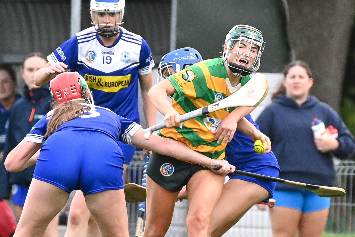  Blackrock's Cliona O'Callaghan is challenged strongly by Inniscarra's Aoife O'Leary and Aine O'Regan, during their Senior Camogie clash at Castle Road.