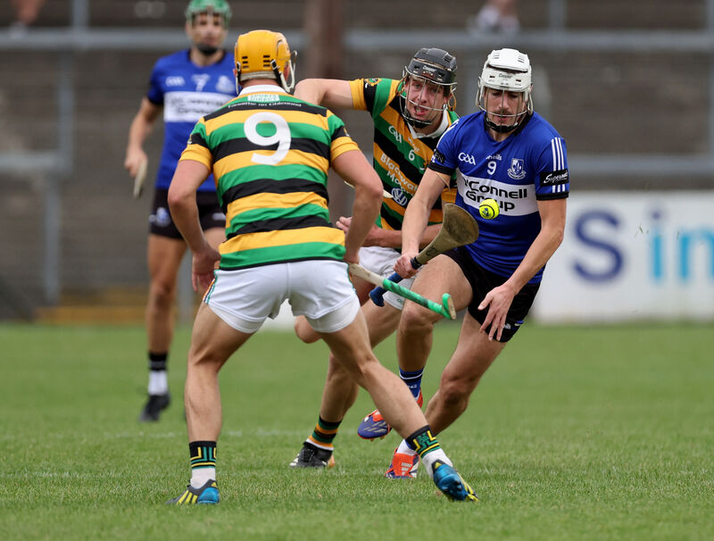 Killian Murphy of Sarsfields takes on Glen Rovers pair Robert Downey and Micheál Mullins, Glen Rovers. Picture: Jim Coughlan. Killian Murphy of Sarsfields takes on Glen Rovers pair Robert Downey and Micheál Mullins, Glen Rovers. Picture: Jim Coughlan.