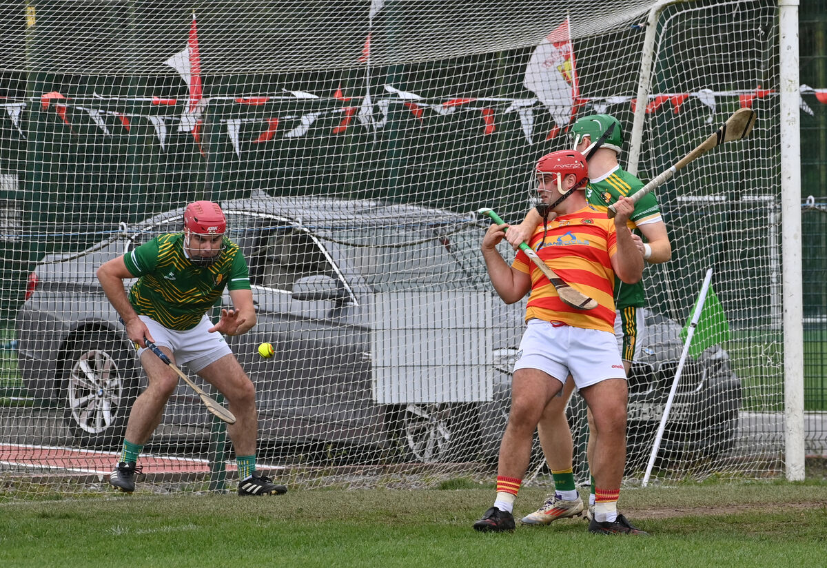 Edmund Kenneally, Newcestown, is held by Paul O'Sullivan of Newtownshandrum as keeper James Bowles wins the ball. Picture: Dan Linehan Edmund Kenneally, Newcestown, is held by Paul O'Sullivan of Newtownshandrum as keeper James Bowles wins the ball. Picture: Dan Linehan