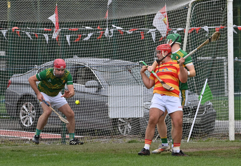  Edmund Kenneally, Newcestown, is held by Paul O'Sullivan of Newtownshandrum as keeper James Bowles wins the ball. Picture: Dan Linehan