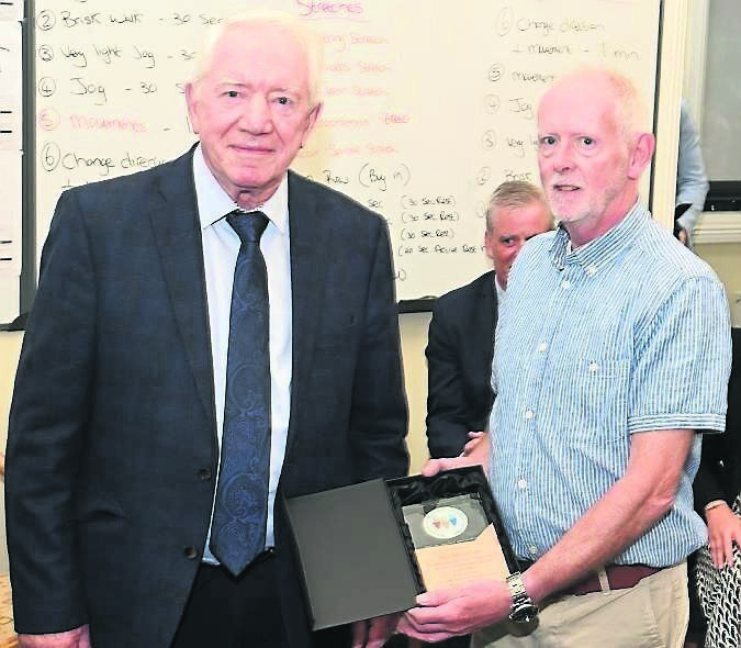 Noel Bridgeman, board of management chair making a presentation to woodwork tutor Val Sheehan marking his retirement after 38 years of service at Mayfield Community Training Centre. Noel Bridgeman, board of management chair making a presentation to woodwork tutor Val Sheehan marking his retirement after 38 years of service at Mayfield Community Training Centre.