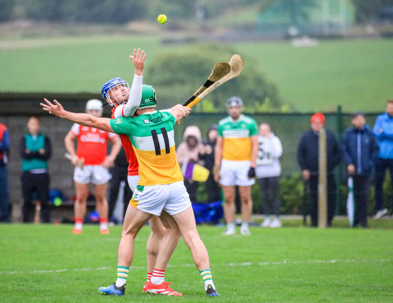 Watergrasshill's Ciaran O'Leary and Bride Rovers' Brian Roche contest possession. Picture: David Creedon