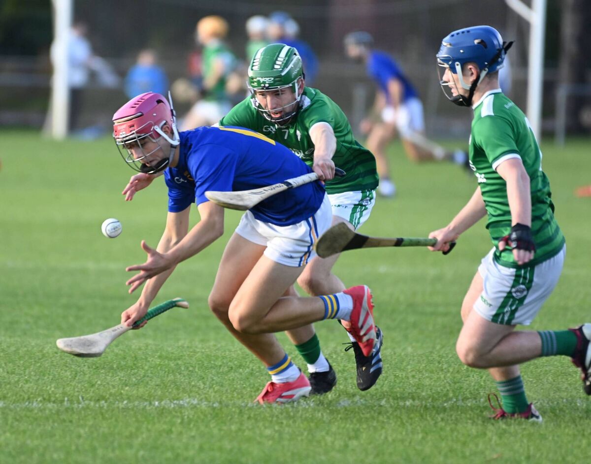 St Finbarr's Alex O'Herlihy gathers the sliotar from Ballincollig's Scott Richmond and Eoin Harris. Picture: Eddie O'Hare