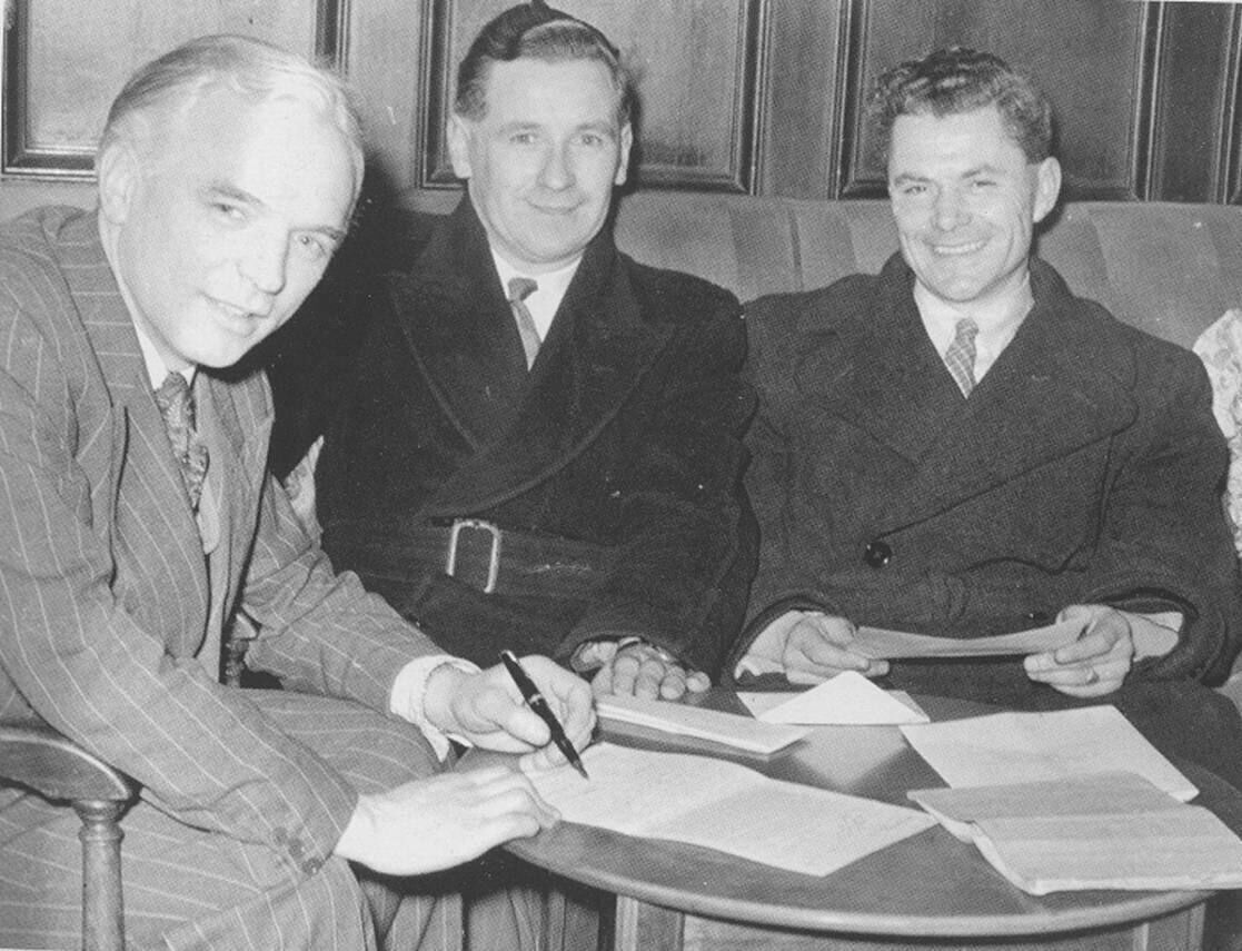 Raich Carter signs for Cork Athletic in January 1953 watched by delighted Cork officials Donie Forde and Dan Fitzgibbon. Raich Carter signs for Cork Athletic in January 1953 watched by delighted Cork officials Donie Forde and Dan Fitzgibbon.