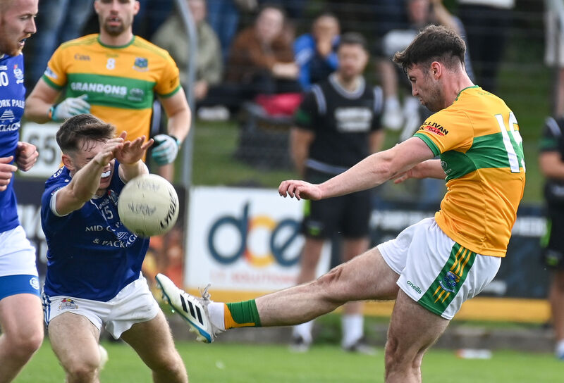  Glanmire's James Crowley has his shot blocked by Ed Ó Mír, of Naomh Abán. Picture: David Keane