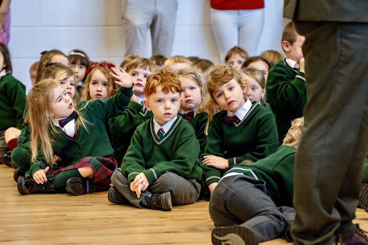 Expressions vary among the junior infants seated on the floor at the front of the assembly hall in Gaelscoil an Ghoirt Álainn as Lord Mayor of Cork  Fergal Dennehy addresses them during his annual visit to primary schools in Cork city. Picture Chani Anderson Expressions vary among the junior infants seated on the floor at the front of the assembly hall in Gaelscoil an Ghoirt Álainn as Lord Mayor of Cork  Fergal Dennehy addresses them during his annual visit to primary schools in Cork city. Picture Chani Anderson