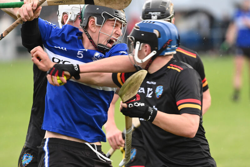 Sarsfields' Eoin Considine bursting through St Colman's Alex Noble and Darragh Heavin. Picture: Eddie O'Hare