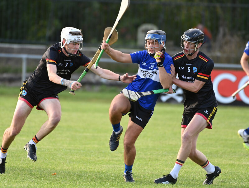  Sarsfields' Cathal Galvin wins the sliotar from St Colman's Darragh Cahill and Tomás O'Reilly. Picture: Eddie O'Hare