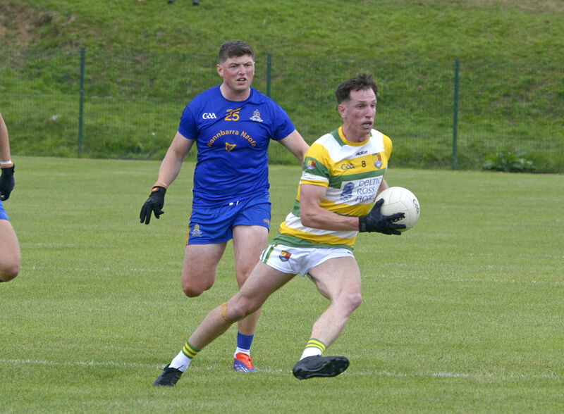 Carbery Rangers' Brian Hodnett takes on Cillian Myers Murray. Picture: Denis Boyle