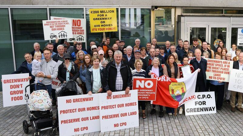 Protesters gather outside County Hall voicing opposition to Cork greenway route   