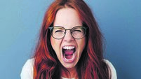 Angry young woman throwing a temper tantrum