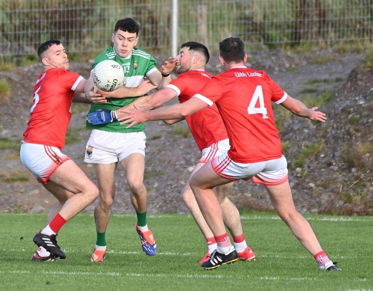 Macroom's is Oisin O'Sullivan tackled by Uibh Laoire's Kevin Manning, Barry Murphy and Daniel O'Riordan. Picture: Eddie O'Hare Macroom's is Oisin O'Sullivan tackled by Uibh Laoire's Kevin Manning, Barry Murphy and Daniel O'Riordan. Picture: Eddie O'Hare
