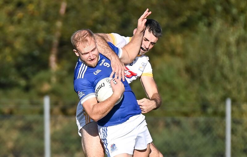 Naomh Aban's Caoimhín Ó Donnchu is tackled by Bandon's Robert Long. Picture: David Keane Naomh Aban's Caoimhín Ó Donnchu is tackled by Bandon's Robert Long. Picture: David Keane