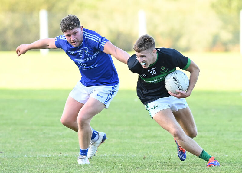Liam Healy, Nemo Rangers, gets away from Bantry Blues' Eoghan O'Shea. Picture: Martin Walsh.