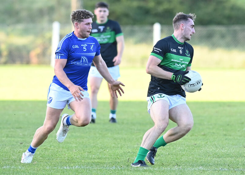 Conor Shalloe, Nemo Rangers, slips by Bantry Blues' Eoghan O'Shea. Picture: Martin Walsh.