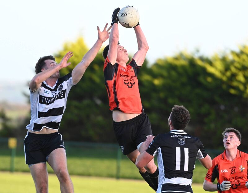 Kiskeam's Adrian Carroll wins the ball from Castletownbere's Oliver Byrne. Picture: Eddie O'Hare