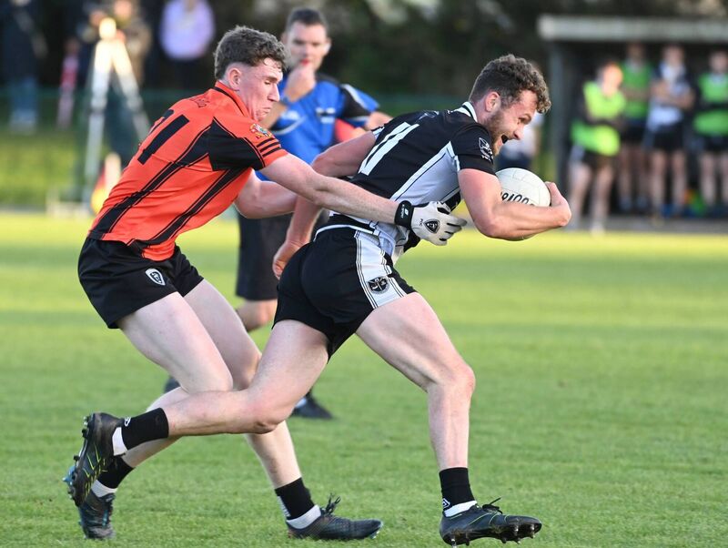 Castletownbere's Fintan Fenner is tackled by Kiskeam's Paul O'Callaghan. Picture: Eddie O'Hare
