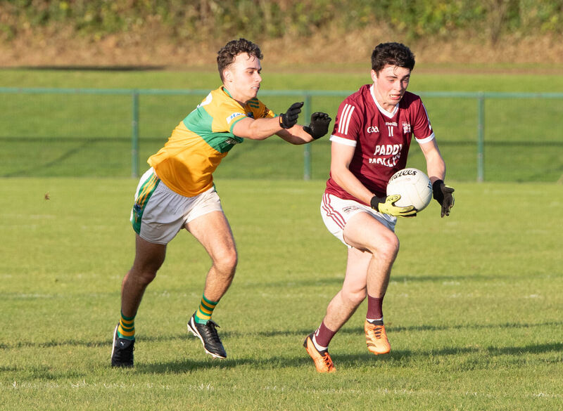 Rockchapel's Ciaran Curtin pulls away from Glanmire's Daniel Molden. Picture: Howard Crowdy