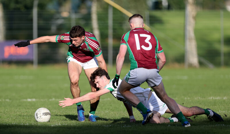 Pauric O'Sullivan and Matthew Bradley, Aghabullogue, hold off Cian Hegarty, Aghada. Picture: Jim Coughlan. Pauric O'Sullivan and Matthew Bradley, Aghabullogue, hold off Cian Hegarty, Aghada. Picture: Jim Coughlan.