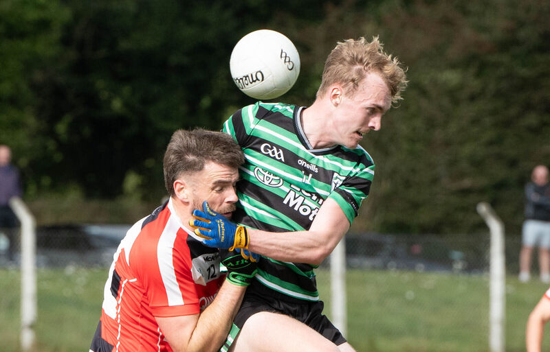 Luis Dwan-Fogarty of Douglas clashes with Ballincollig's Peter O'Neill. Picture: Howard Crowdy Luis Dwan-Fogarty of Douglas clashes with Ballincollig's Peter O'Neill. Picture: Howard Crowdy