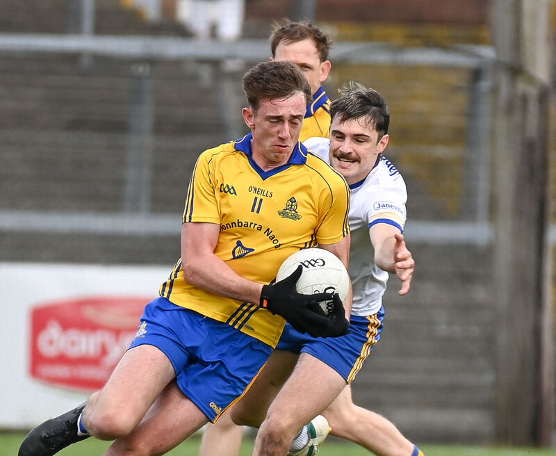 St Finbarr's Ethan Twomey drives past Carrigaline's Kevin O'Reilly. Picture: David Keane. St Finbarr's Ethan Twomey drives past Carrigaline's Kevin O'Reilly. Picture: David Keane.