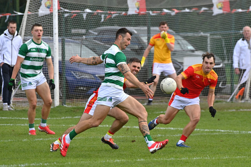 Fiachra Lynch, Valley Rovers, about to score a point as Mallow players Bill Myers and Paul Lyons try to block him down. Picture: Dan Linehan Fiachra Lynch, Valley Rovers, about to score a point as Mallow players Bill Myers and Paul Lyons try to block him down. Picture: Dan Linehan