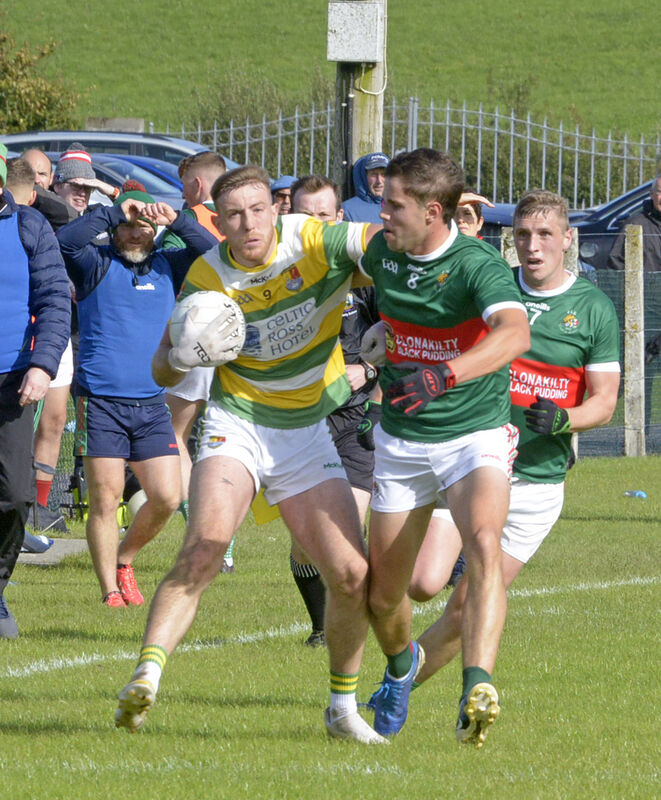 Ben Ridgeway of Clonakilty battles against Brian Hodnett of Carbery Rangers. Picture: Denis Boyle