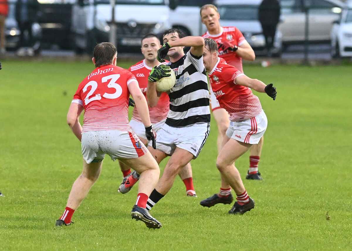 St Nick's Jake Brosnan breaks through a quartet of Urhan players including Dylan Crowley and Alan Elphick. Picture: Martin Walsh.