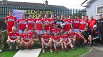 Lough Rovers footballers lift Flor McCarthy Cup against Ballinure at Ballinlough