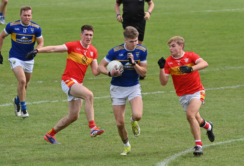  Conor McGoldrick and Colm Clifford of Éire Óg can not stop the breaking Tom Cunningham. Picture: Dan Linehan