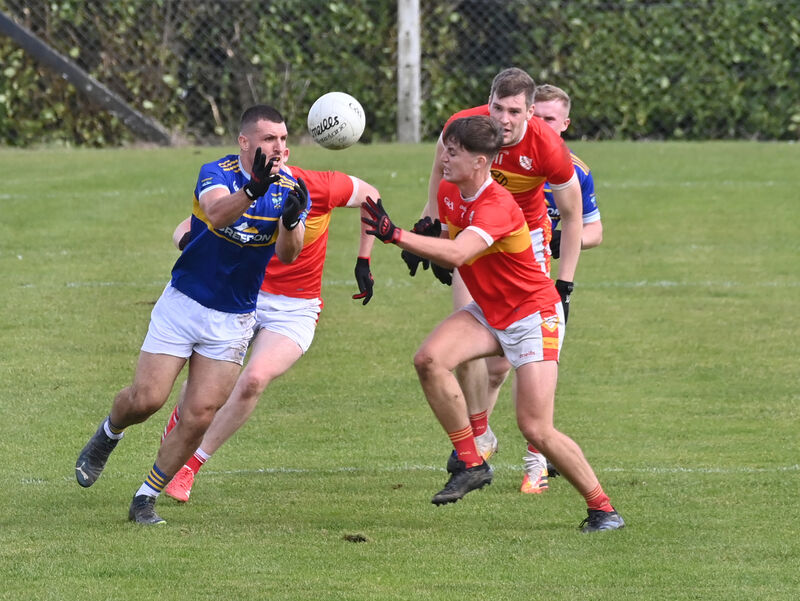  Darragh Clifford, Éire Óg, and Jack Twomey, Kilshannig, fight for this breaking ball. Picture: Dan Linehan