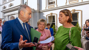 <p>Antoinette Burke (right), mother of Katie Burke from Cobh, confronts Taoiseach Micheál Martin (left), alongside Fianna Fáil TD Mary Butler (centre) outside the Fianna Fáil's parliamentary party annual think-in at the Rochestown Park Hotel in Co Cork, over the lack of healthcare treatment her daughter, who lives with cerebral palsy, has received.</p>