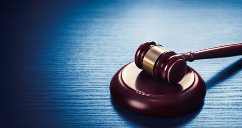 judge gavel on a blue wooden background