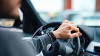 An Unrecognizable Businessman Driving His Car