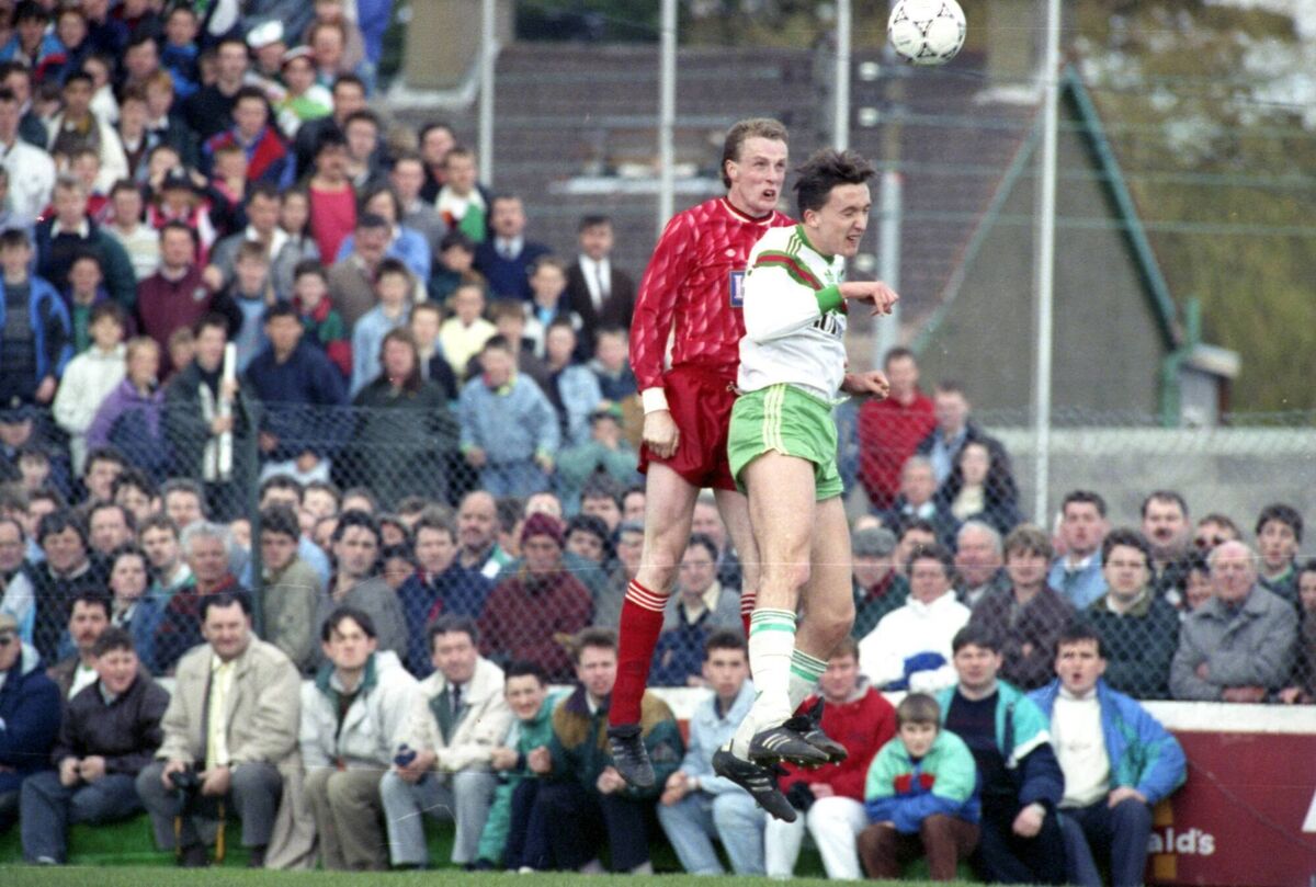 Dundalk's James Coll and Cork City's Len Downey fight for the ball