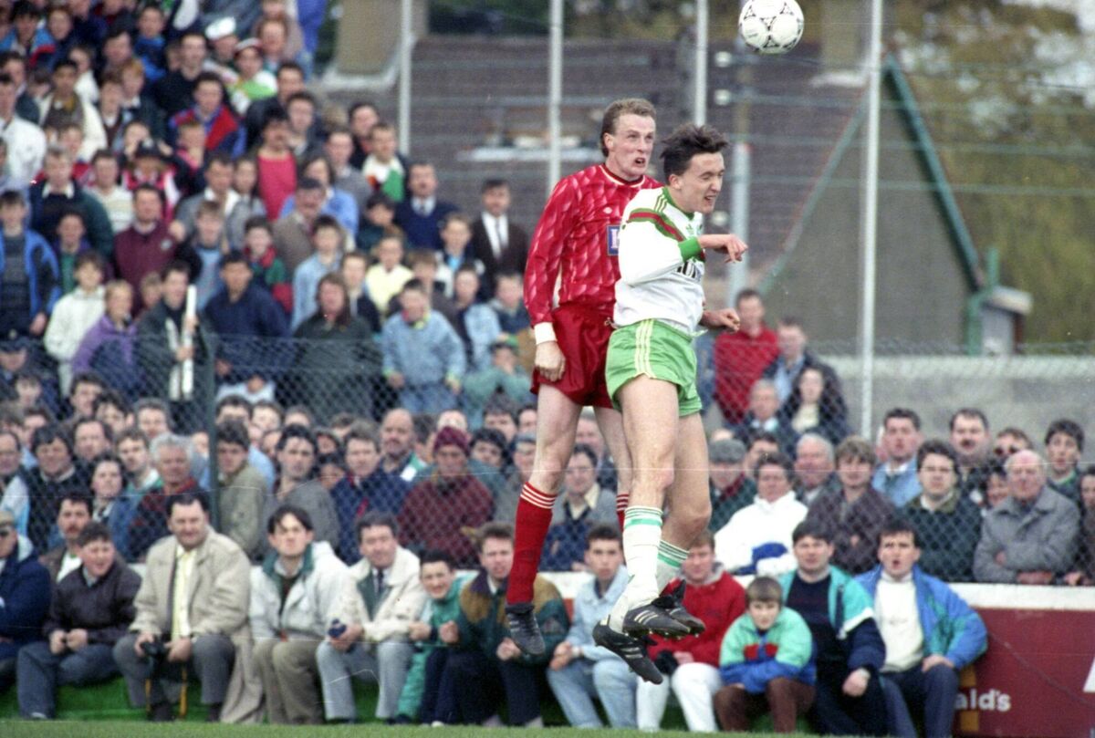 Dundalk's James Coll and Cork City's Len Downey fight for the ball