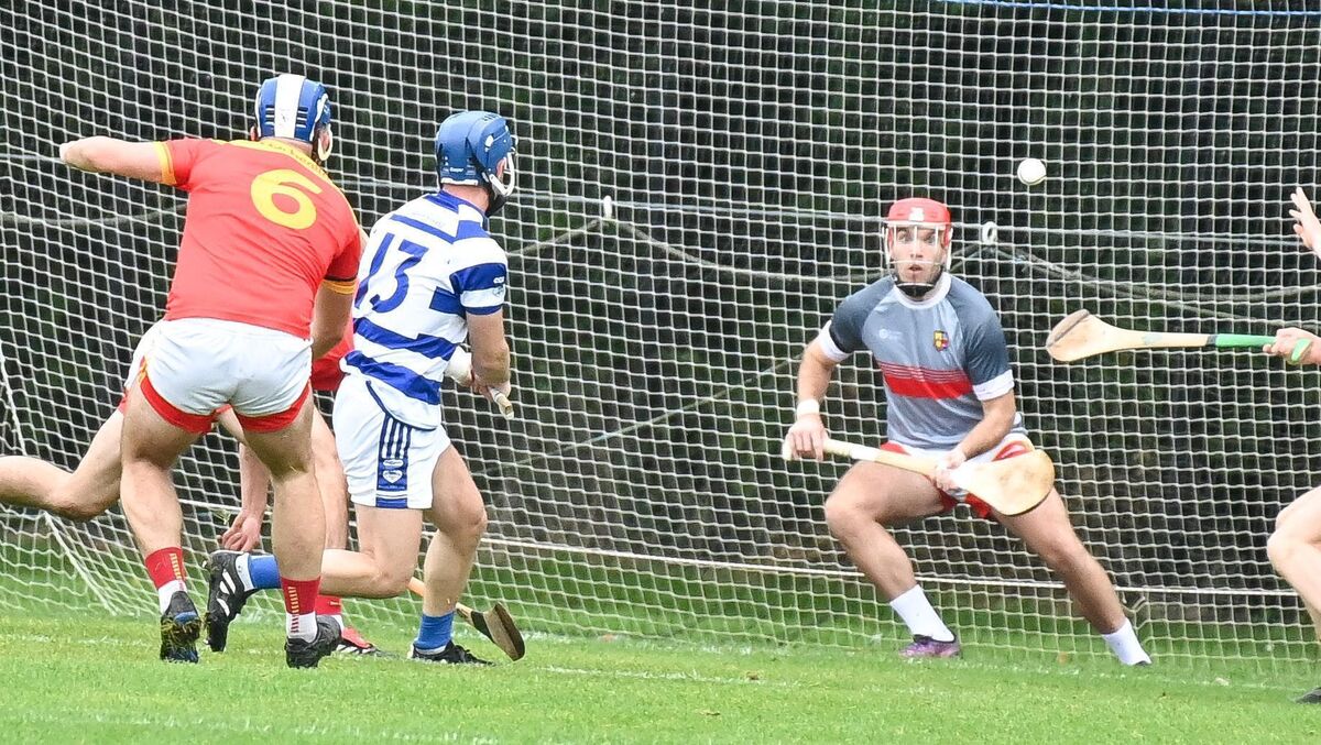 Inniscarra's David O'Keeffe hammers the ball to the Mallow net past Padge Buckley in 2023. Picture: David Keane