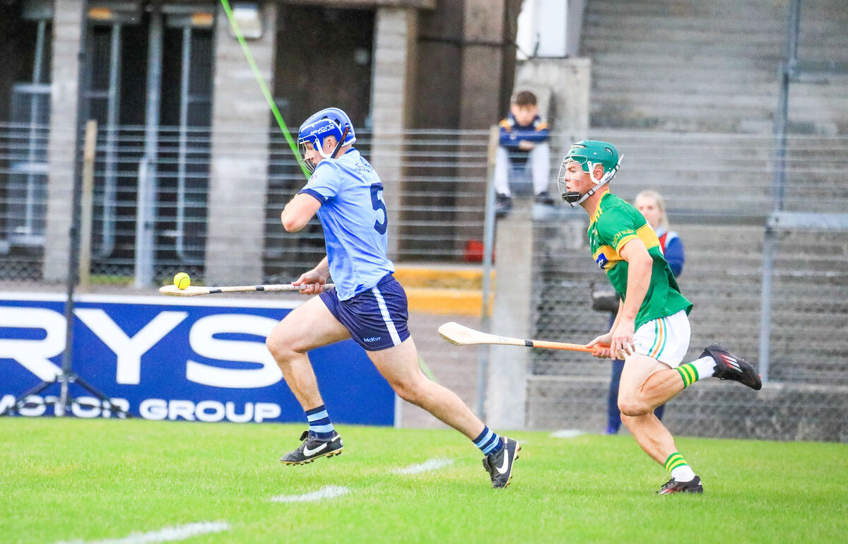 Barryroe's Jerome O'Brien solo's upfield while chased by Cloughduv's Aaron Elliott. Picture: David Creedon