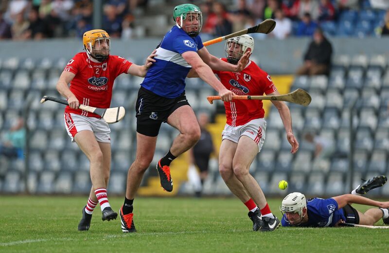 Finbarr Cagney and Jack Buckley, Charleville, battle with James Sweeney, Sarsfields during the Division 1 HL final last year. Picture: Jim Coughlan. Finbarr Cagney and Jack Buckley, Charleville, battle with James Sweeney, Sarsfields during the Division 1 HL final last year. Picture: Jim Coughlan.