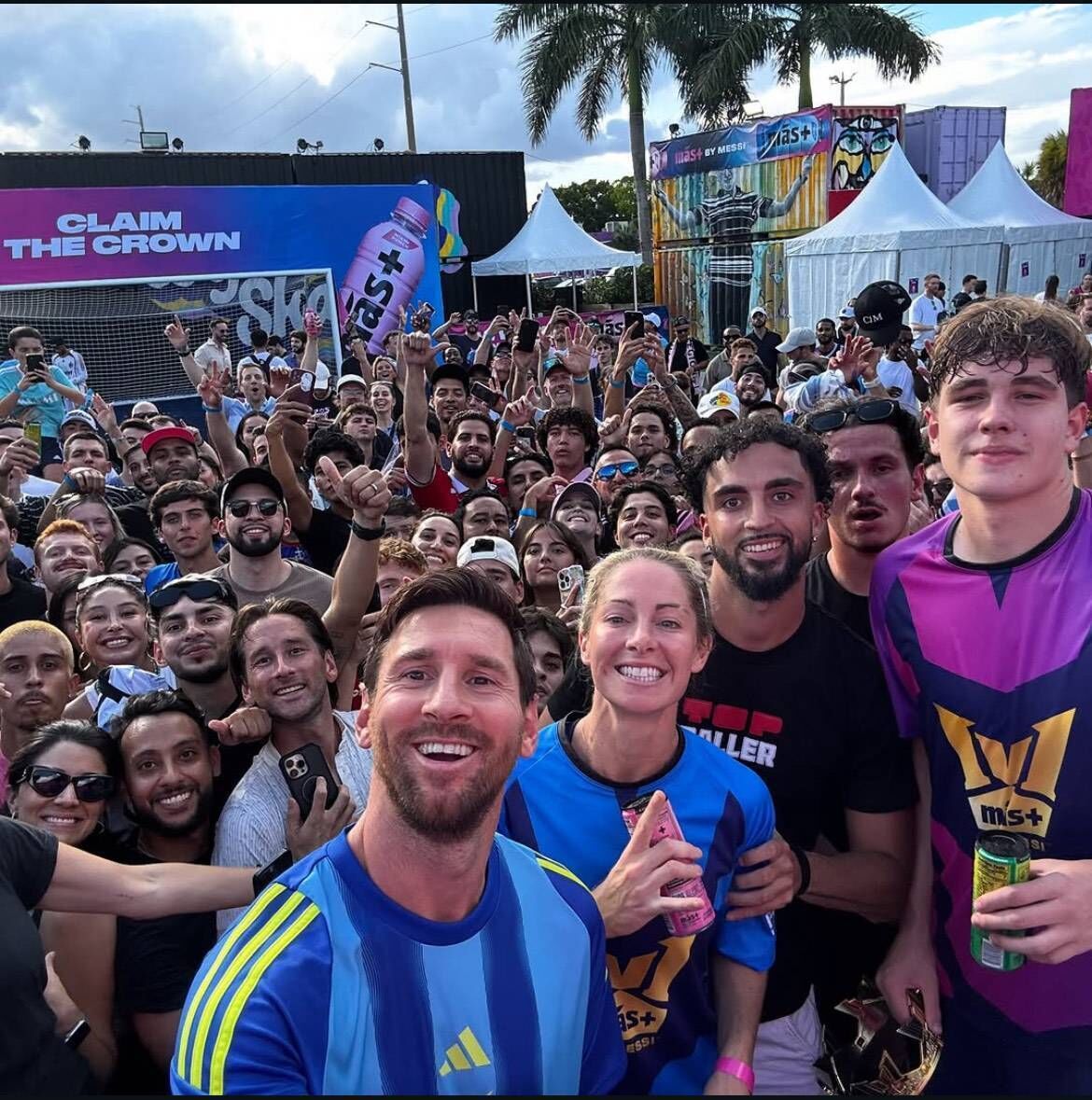 Soccer legend Lionel Messi celebrates with Cobh Ramblers' Evan Deasy, far right.