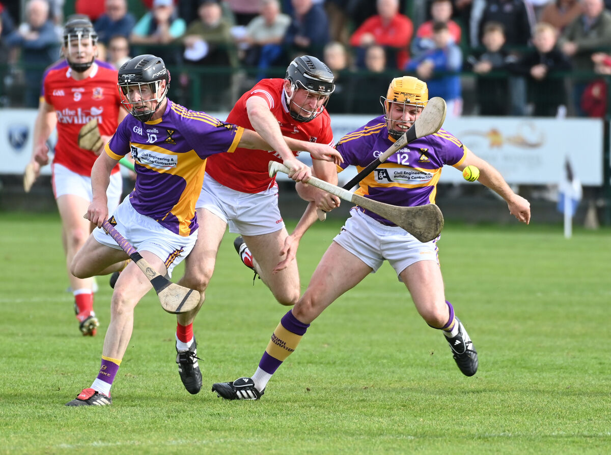 Ballygarvan's Ciaran McIntyre is tackled by St Catherine's James Neville and Eoin Condon. Picture Eddie O'Hare