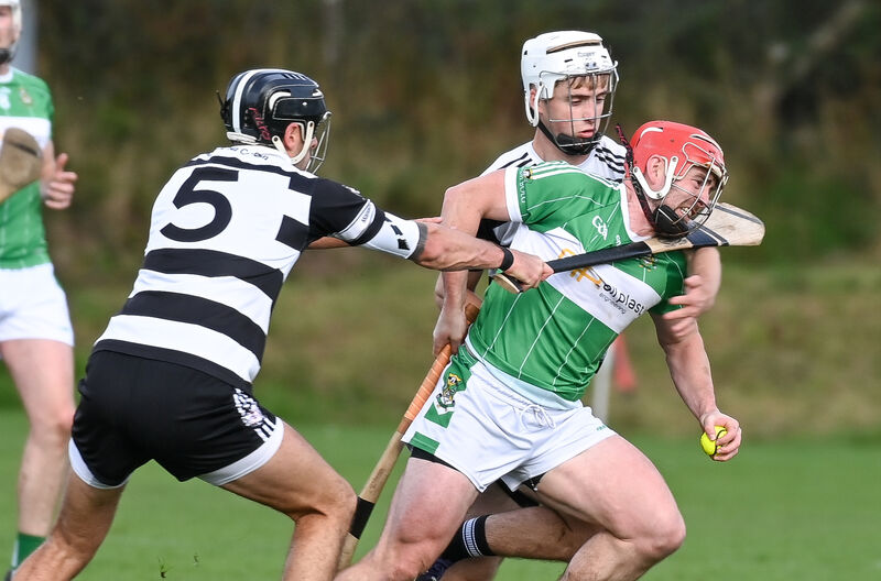  Aghabullogue's John Corkery is tackled by Midleton's Cillian Burke. Picture: David Keane.
