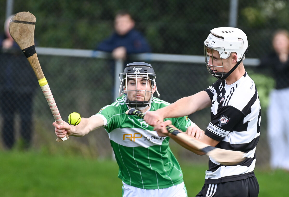 Midleton's Carthaigh Cronin clears his lines as Aghabullogue's James Lane closes in. Picture: David Keane. Midleton's Carthaigh Cronin clears his lines as Aghabullogue's James Lane closes in. Picture: David Keane.