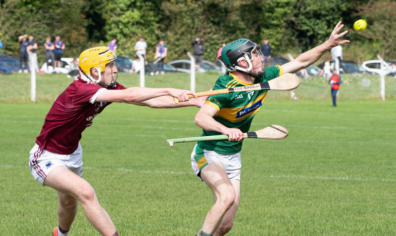 Cloughduv's Sean O'Leary reaches out for the sliothar ahead of Joe Crowley of Agrideen Rangers during the PJHC match in Ballygarvan. Picture: Howard Crowdy