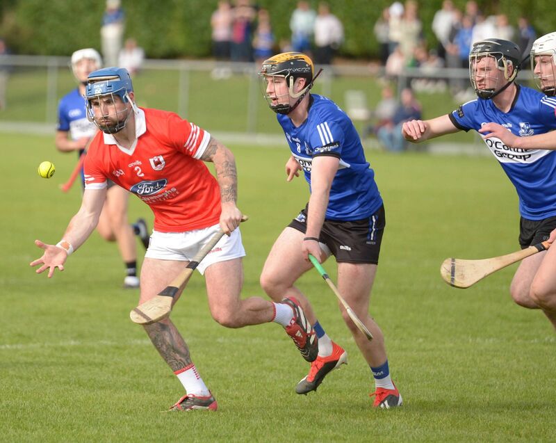 Darren Butler of Charleville clears under pressure from Daniel Hogan. Picture: John Tarrrant 
