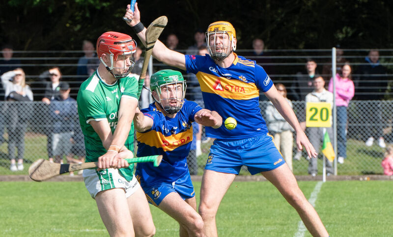 Ballincollig's Cian O'Driscoll about to clear the ball up field despite the attention from Carrigaline's Darragh King during the PIHC match in Riverstick. Picture: Howard Crowdy