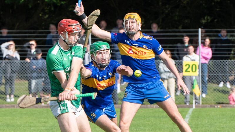 Ballincollig's Cian O'Driscoll about to clear the ball up field despite the attention from Carrigaline's Darragh King during the PIHC match in Riverstick. Picture: Howard Crowdy