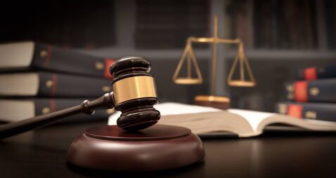 Judge gavel and scale in court. Legal concept